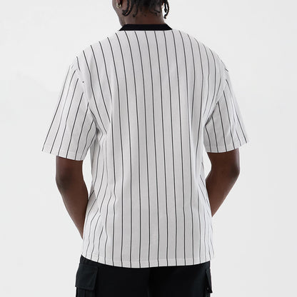 The model is wearing this New Era Pinstripe Oversized T-Shirt in Open White. 2