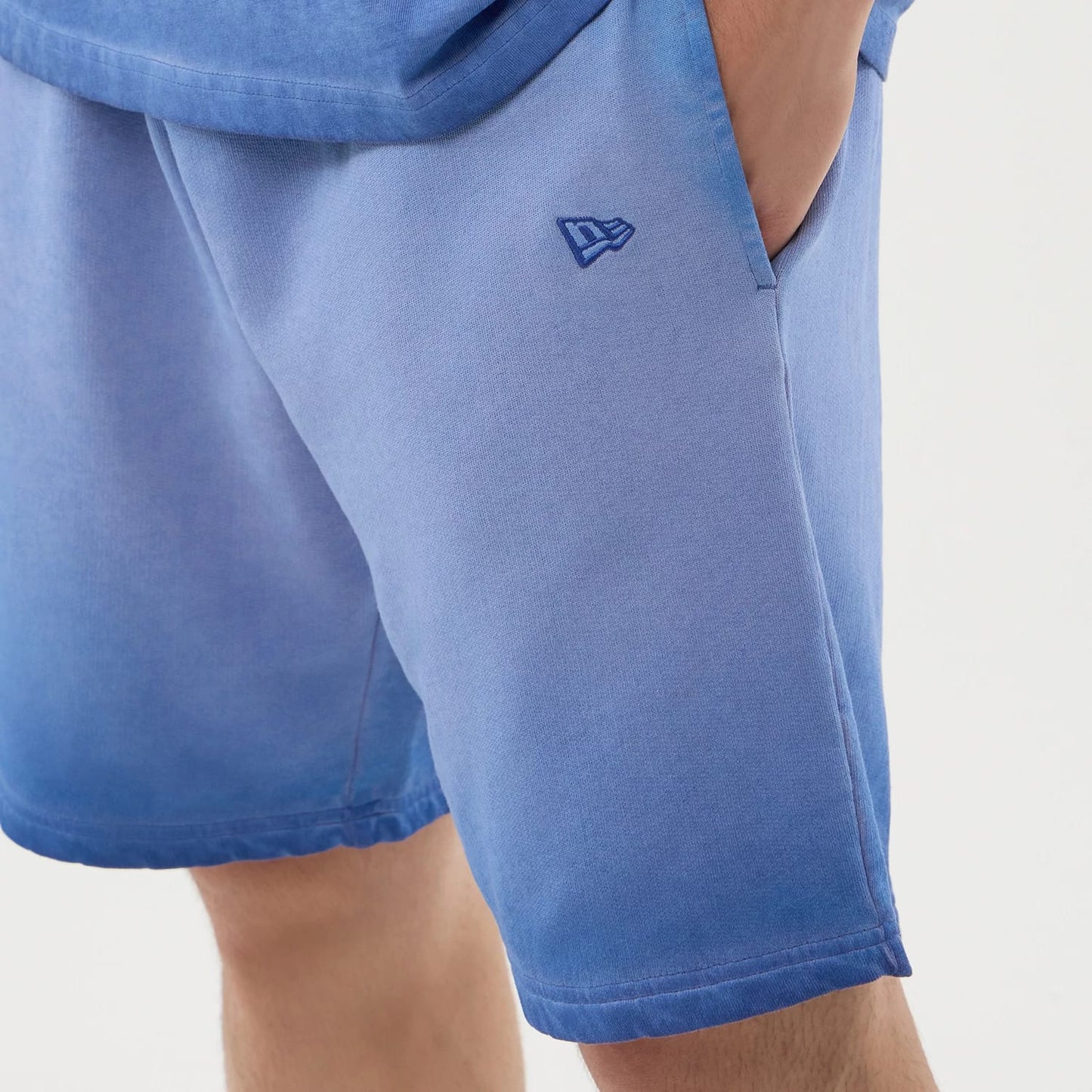 The model is wearing this MLB Washed Logo LA Dodgers Shorts in pastel blue. 5