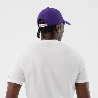 The model is wearing this NBA Graphic LA Lakers T-Shirt in white. 7