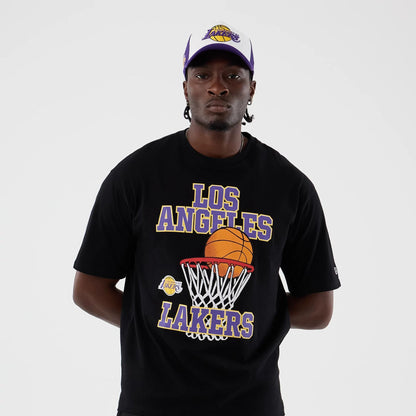 The model is wearing this NBA Basketball Graphic LA Lakers Oversized T-Shirt in black. 3