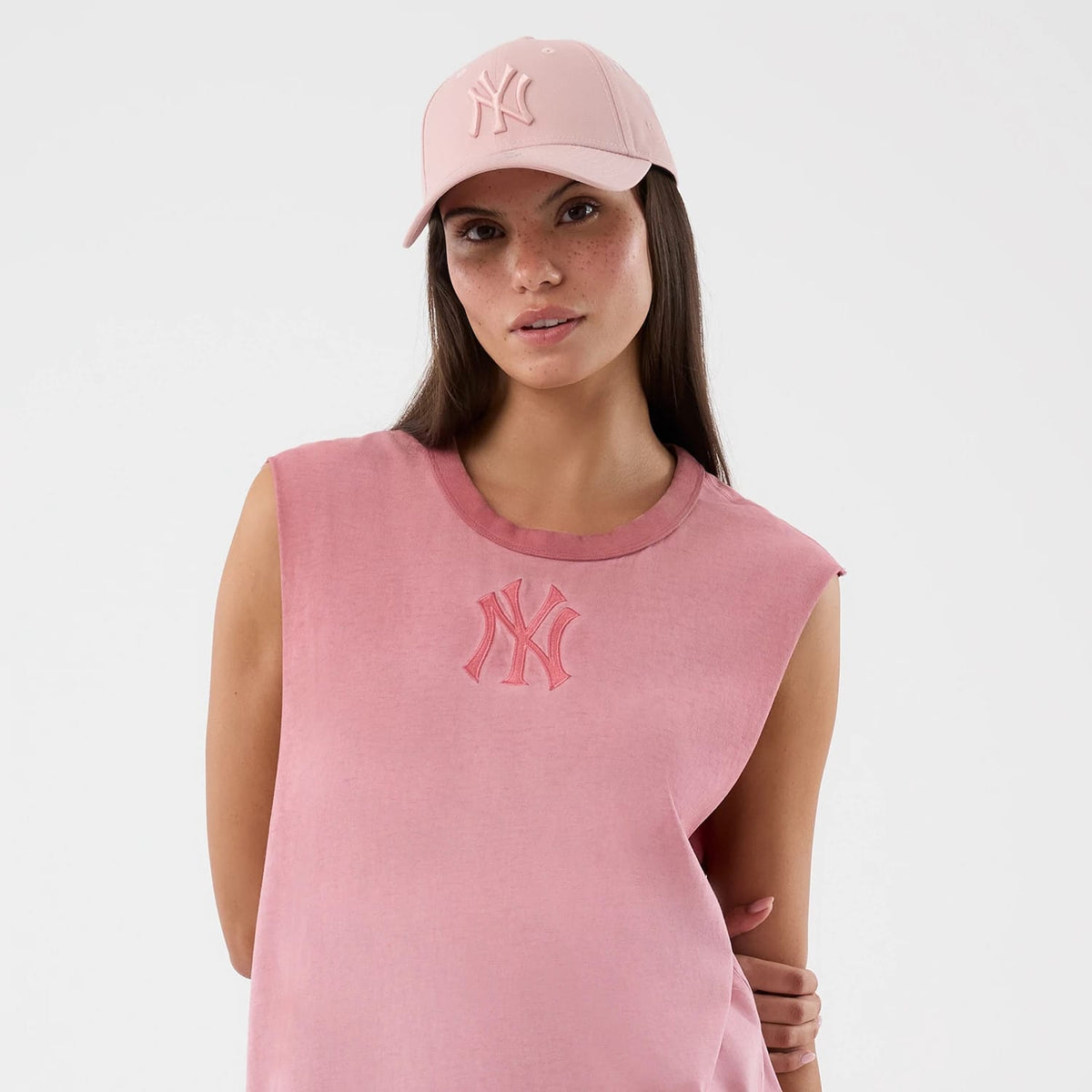 The model is wearing this MLB Washed Logo New York Yankees Vest in pastel pink. 6