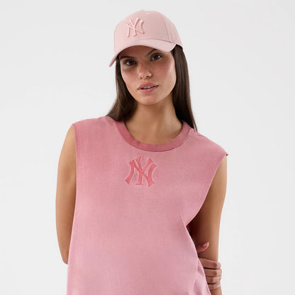 The model is wearing this MLB Washed Logo New York Yankees Vest in pastel pink. 6