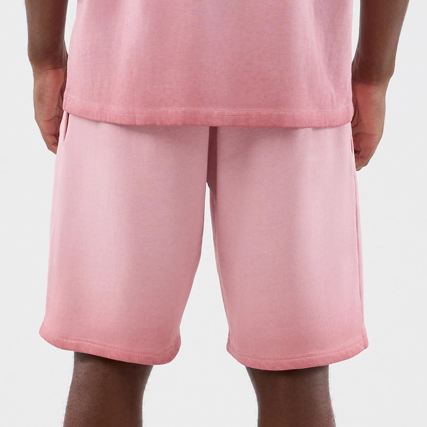 The model is wearing this MLB Washed Logo New York Yankees Shorts in pastel pink. 6