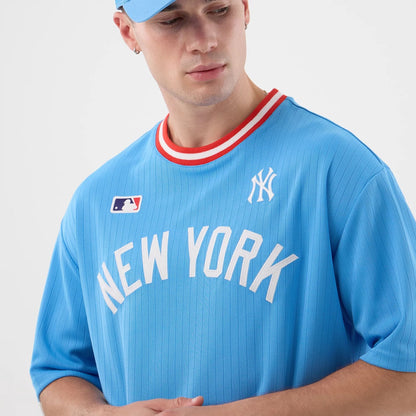 The model is wearing this MLB Arch New York Yankees Oversized T-Shirt in pastel blue. 4