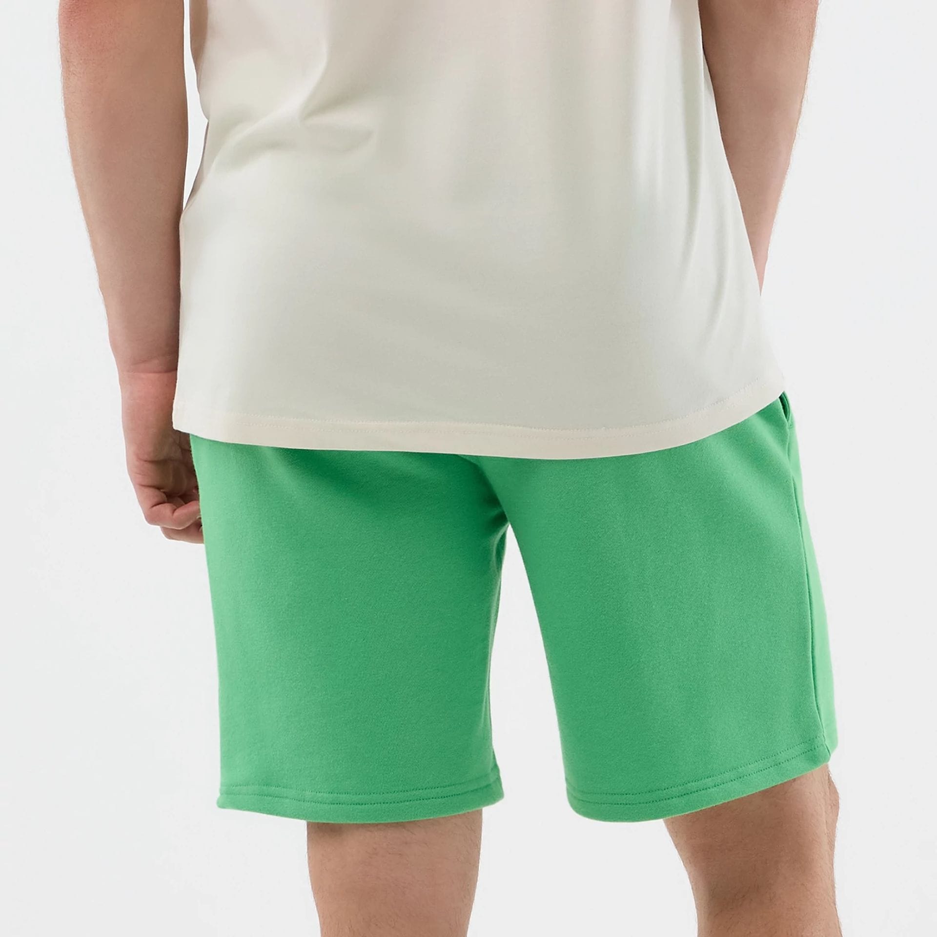 The model is wearing this MLB League Essential LA Dodgers Shorts in open green. 7