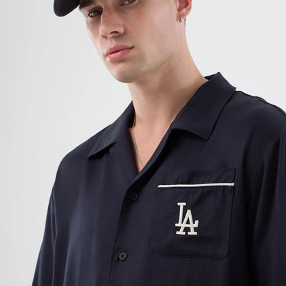 The model is wearing this MLB Graphic Revere LA Dodgers Short Sleeve Shirt in navy. 5