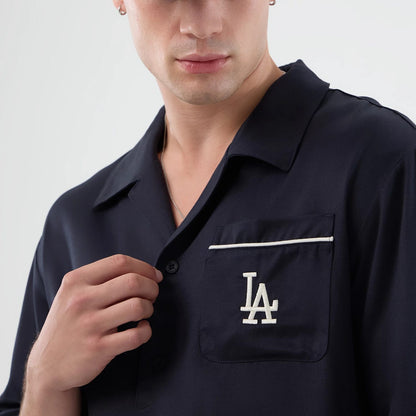 The model is wearing this MLB Graphic Revere LA Dodgers Short Sleeve Shirt in navy. 7