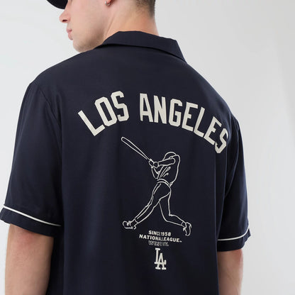 The model is wearing this MLB Graphic Revere LA Dodgers Short Sleeve Shirt in navy. 4