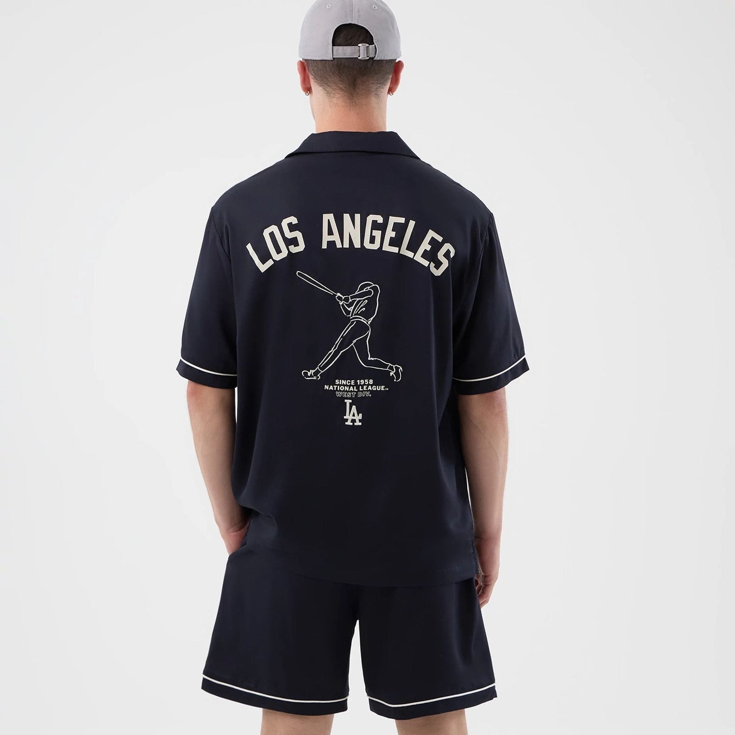 The model is wearing this MLB Graphic Revere LA Dodgers Short Sleeve Shirt in navy. 2