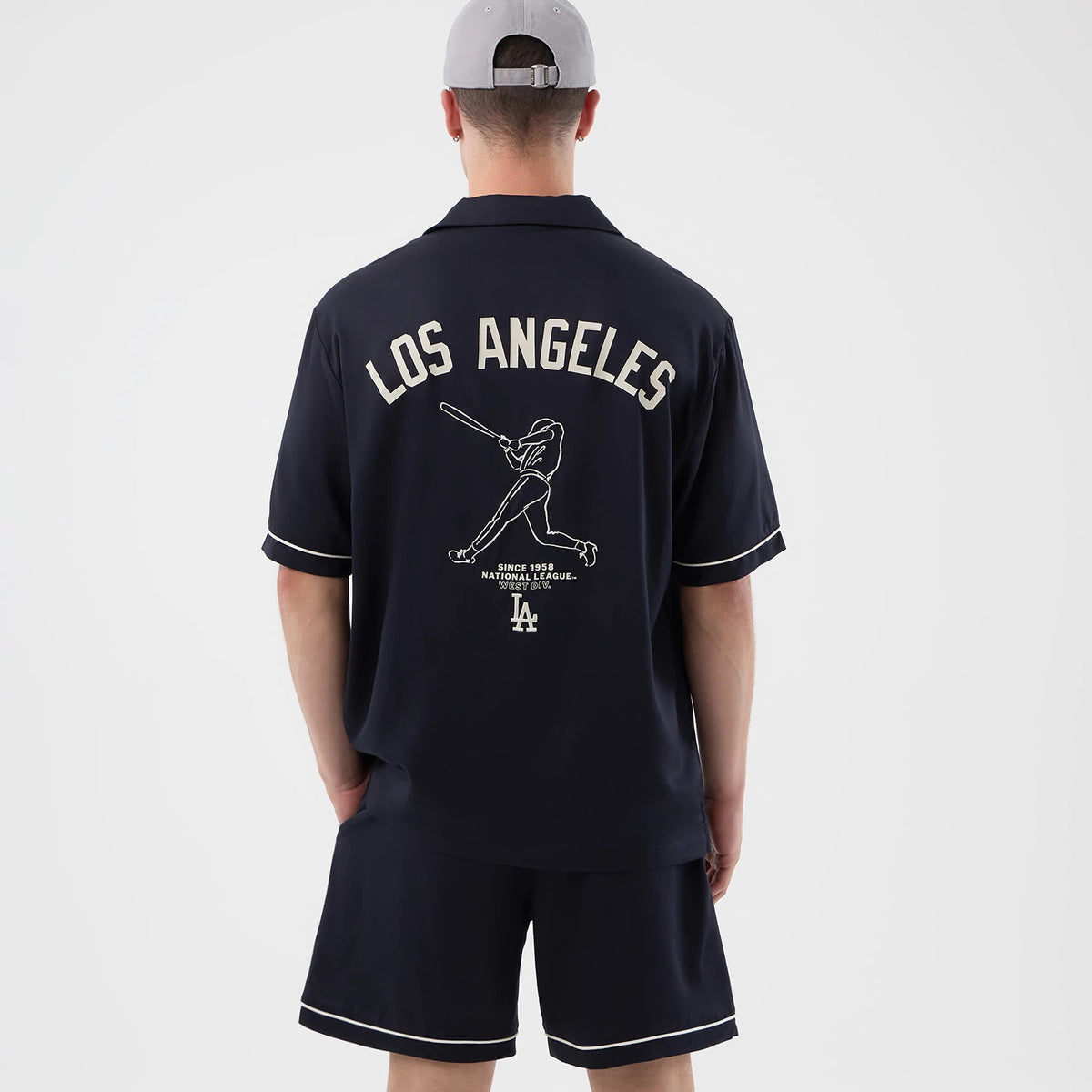 The model is wearing this MLB Graphic Revere LA Dodgers Short Sleeve Shirt in navy. 2