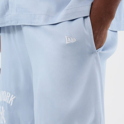 The model is wearing this MLB Woven New York Yankees Shorts in pastel blue. 5