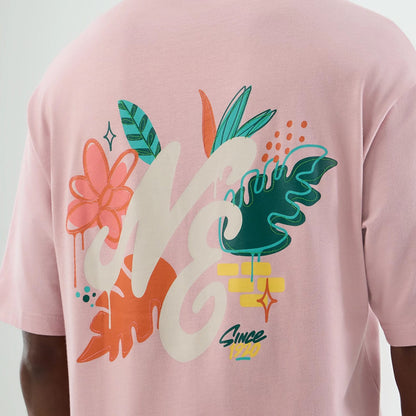 The model is wearing this New Era Floral Graphic Oversized T-Shirt in pastel pink. 8