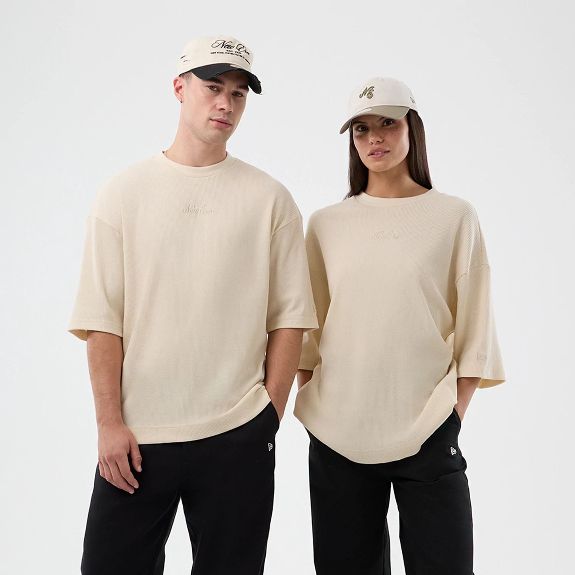The model is wearing this New Era Waffle T-Shirt in light beige. 1