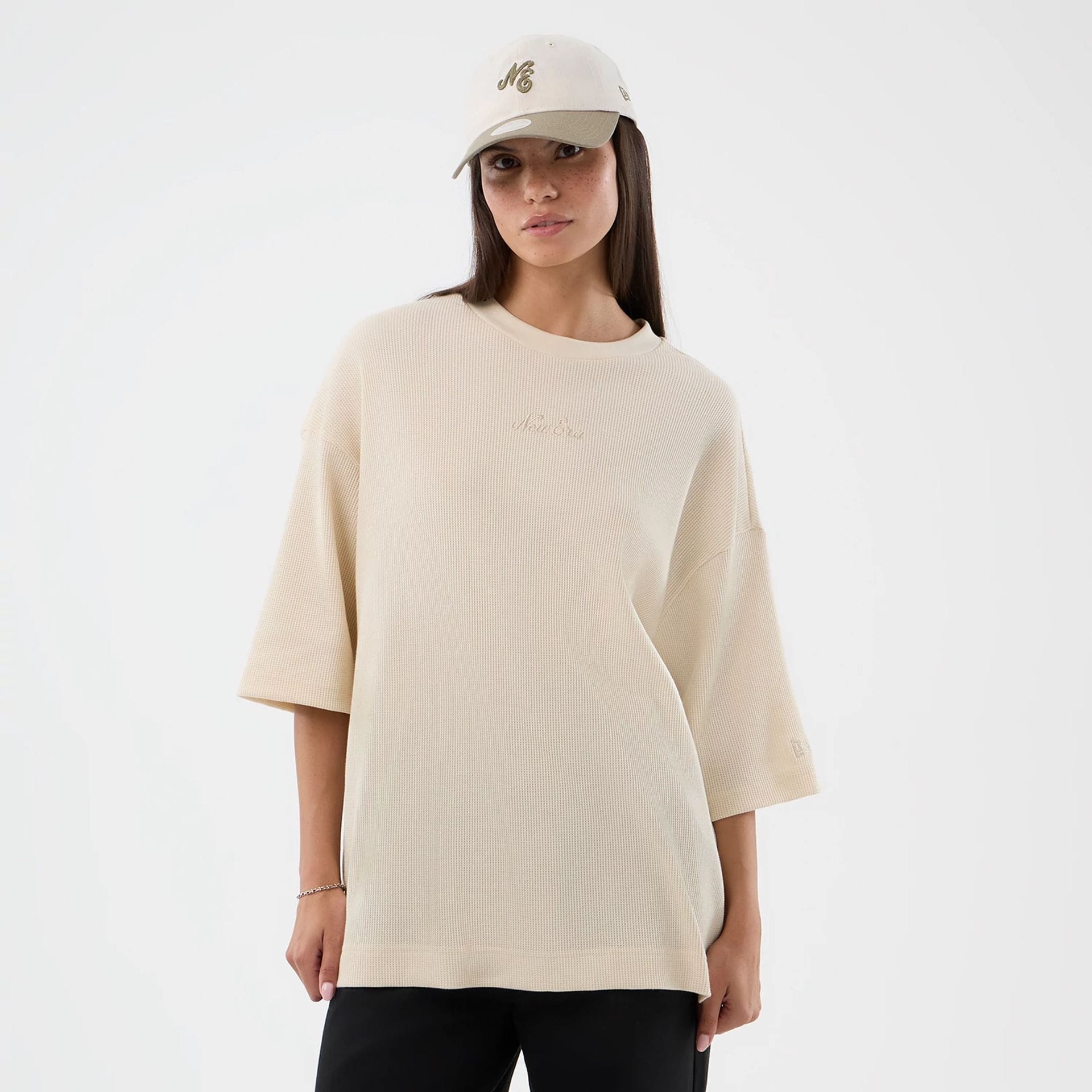 The model is wearing this New Era Waffle T-Shirt in light beige. 4