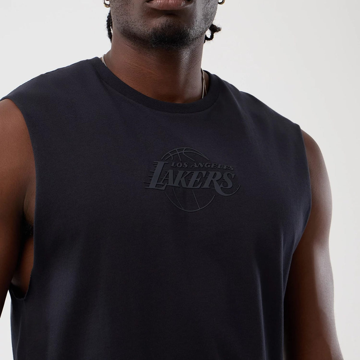 The model is wearing this NBA Core Plus LA Lakers Vest in navy. 5