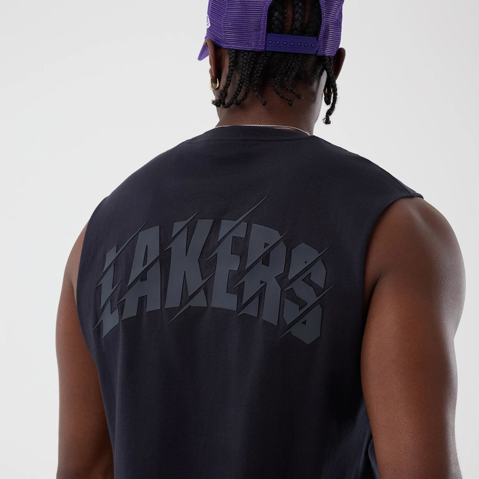 The model is wearing this NBA Core Plus LA Lakers Vest in navy. 4