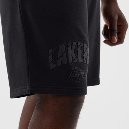 The model is wearing this NBA Core Plus LA Lakers Shorts in navy. 5