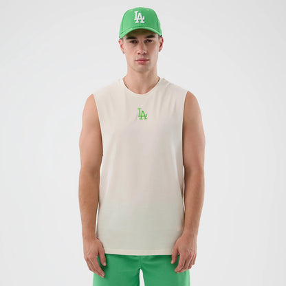New Era LA Dodgers MLB League Essential Open White Vest, front view on a model with a matching green New Era cap, showing a green LA logo embroidered on the chest, sleeveless design, and relaxed fit.