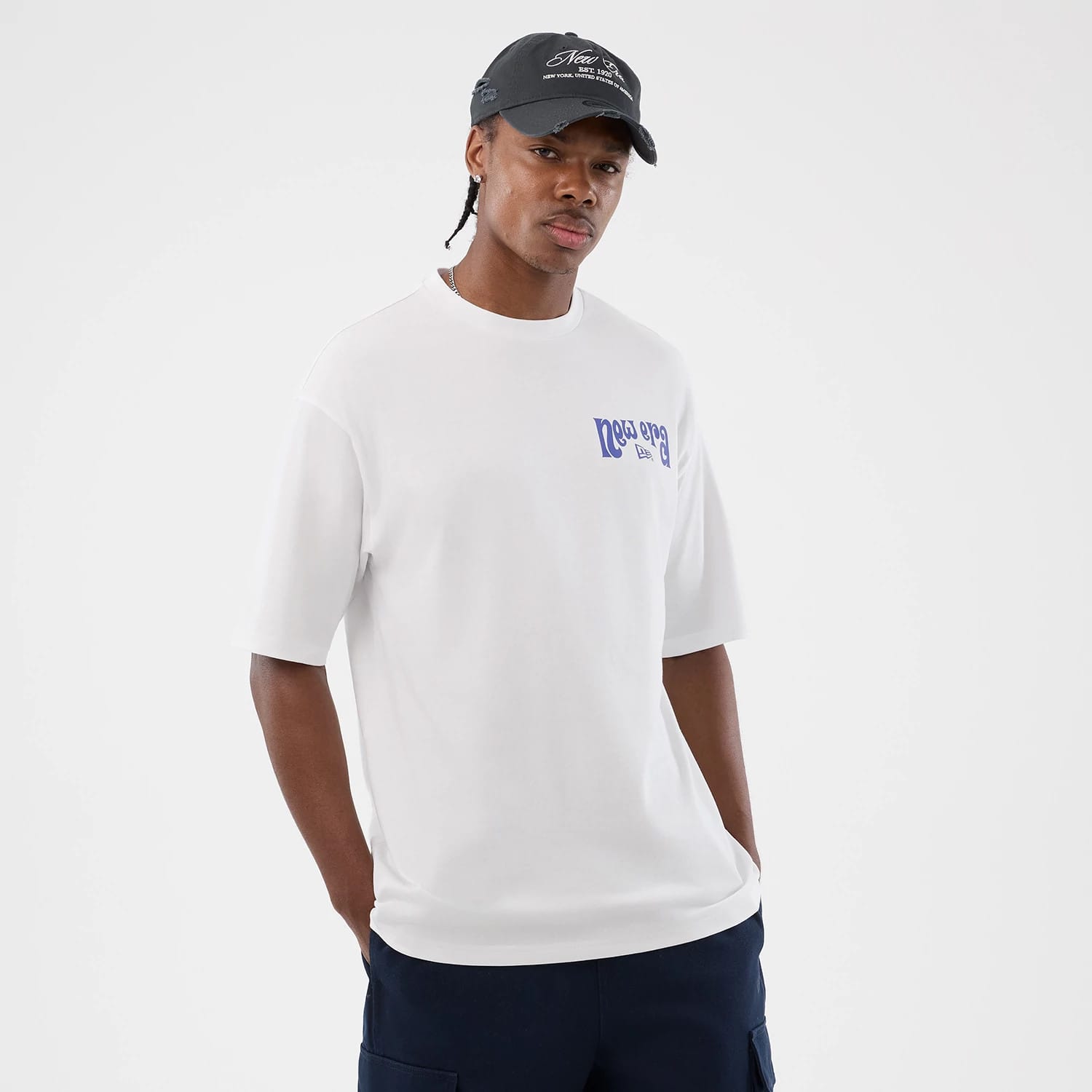 The model is wearing this New Era Fun Pizza Graphic Oversized T-Shirt in white. 3
