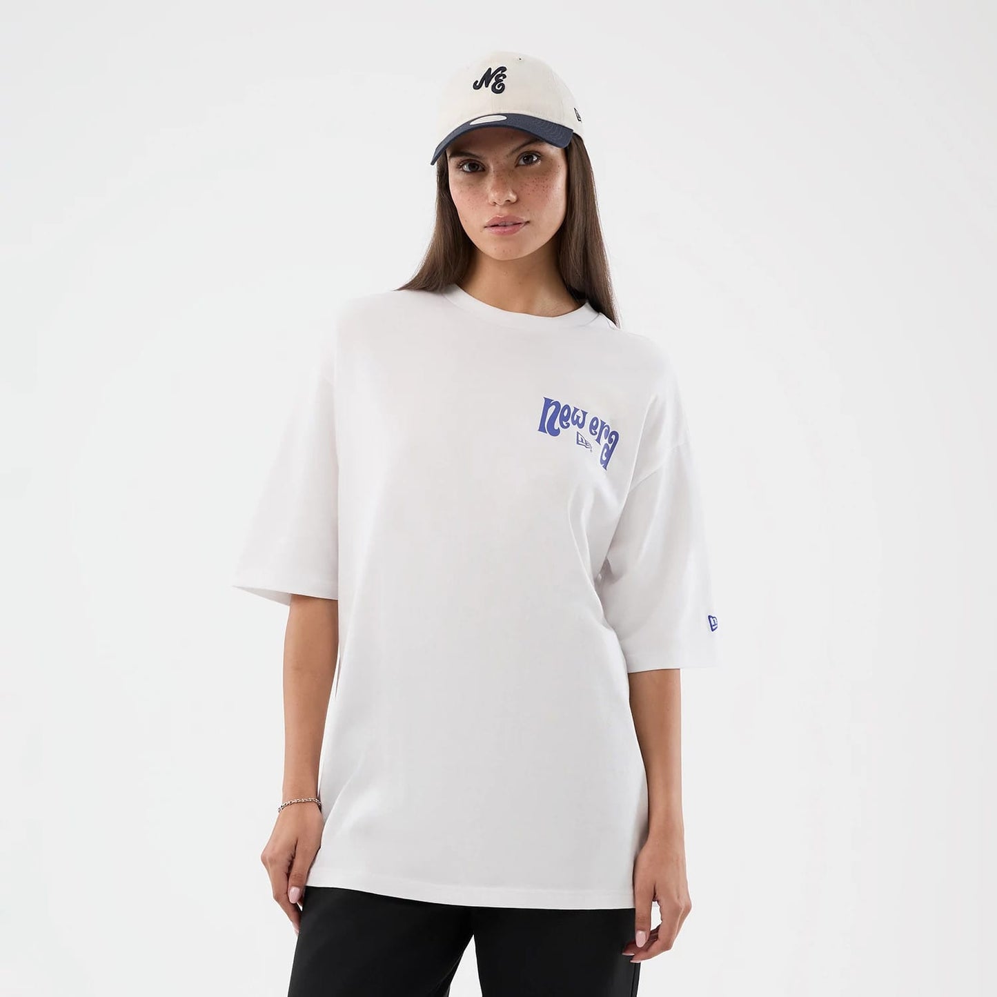 The model is wearing this New Era Fun Pizza Graphic Oversized T-Shirt in white. 5