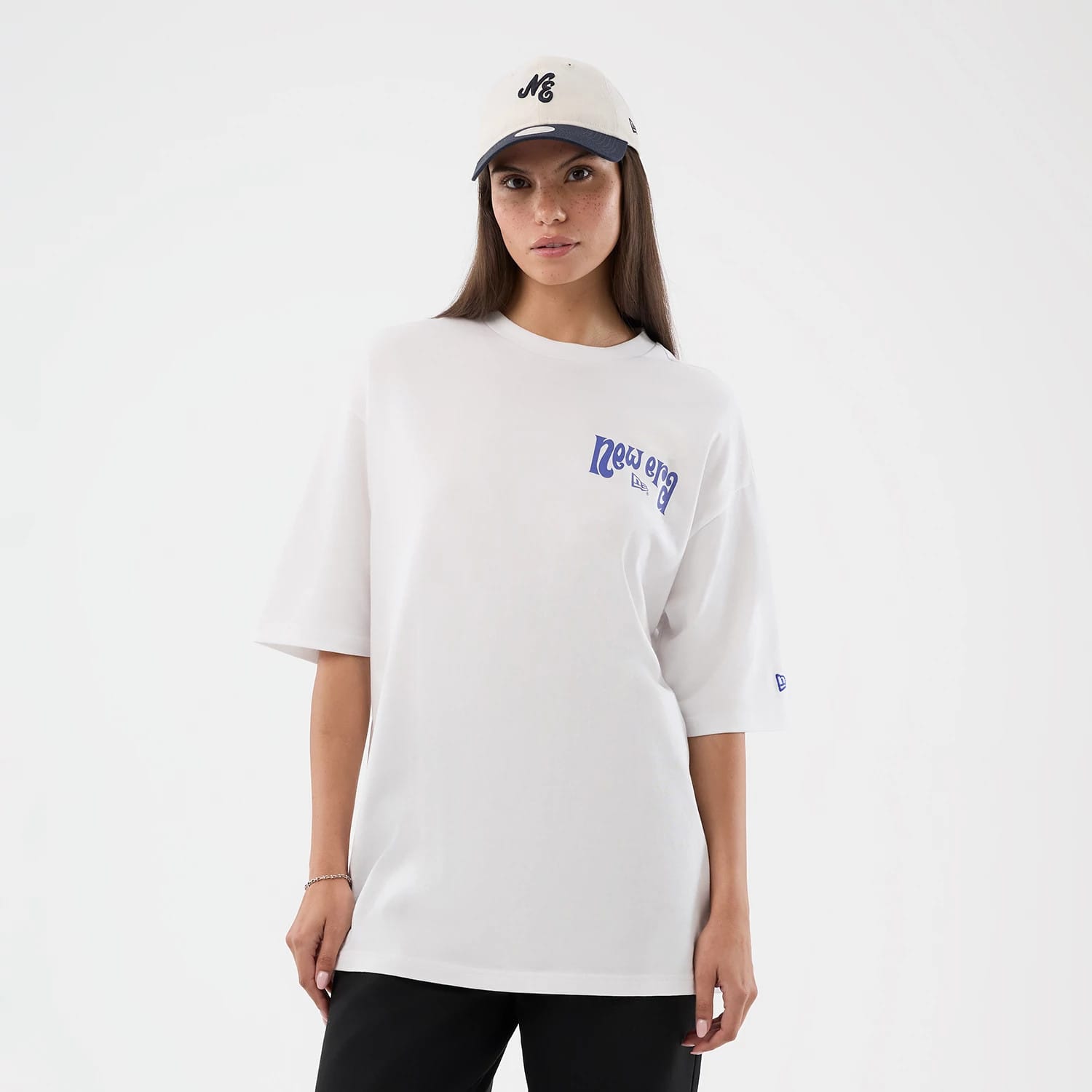 The model is wearing this New Era Fun Pizza Graphic Oversized T-Shirt in white. 5