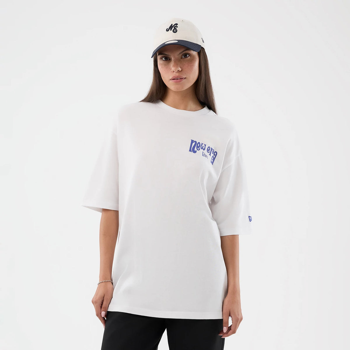 The model is wearing this New Era Fun Pizza Graphic Oversized T-Shirt in white. 5