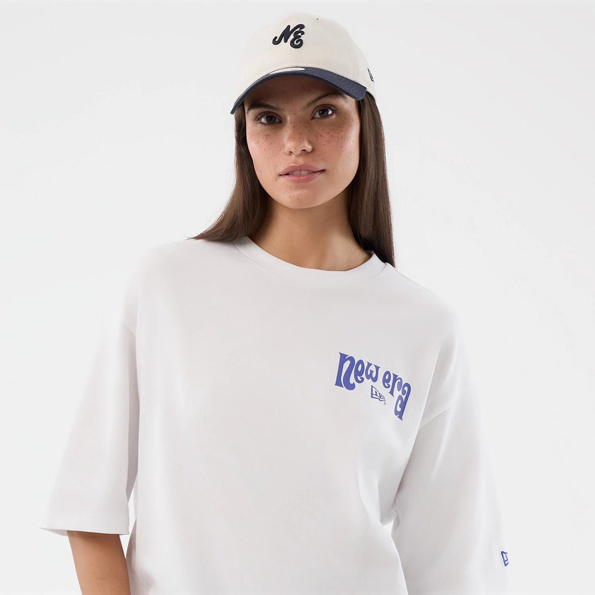 The model is wearing this New Era Fun Pizza Graphic Oversized T-Shirt in white. 7