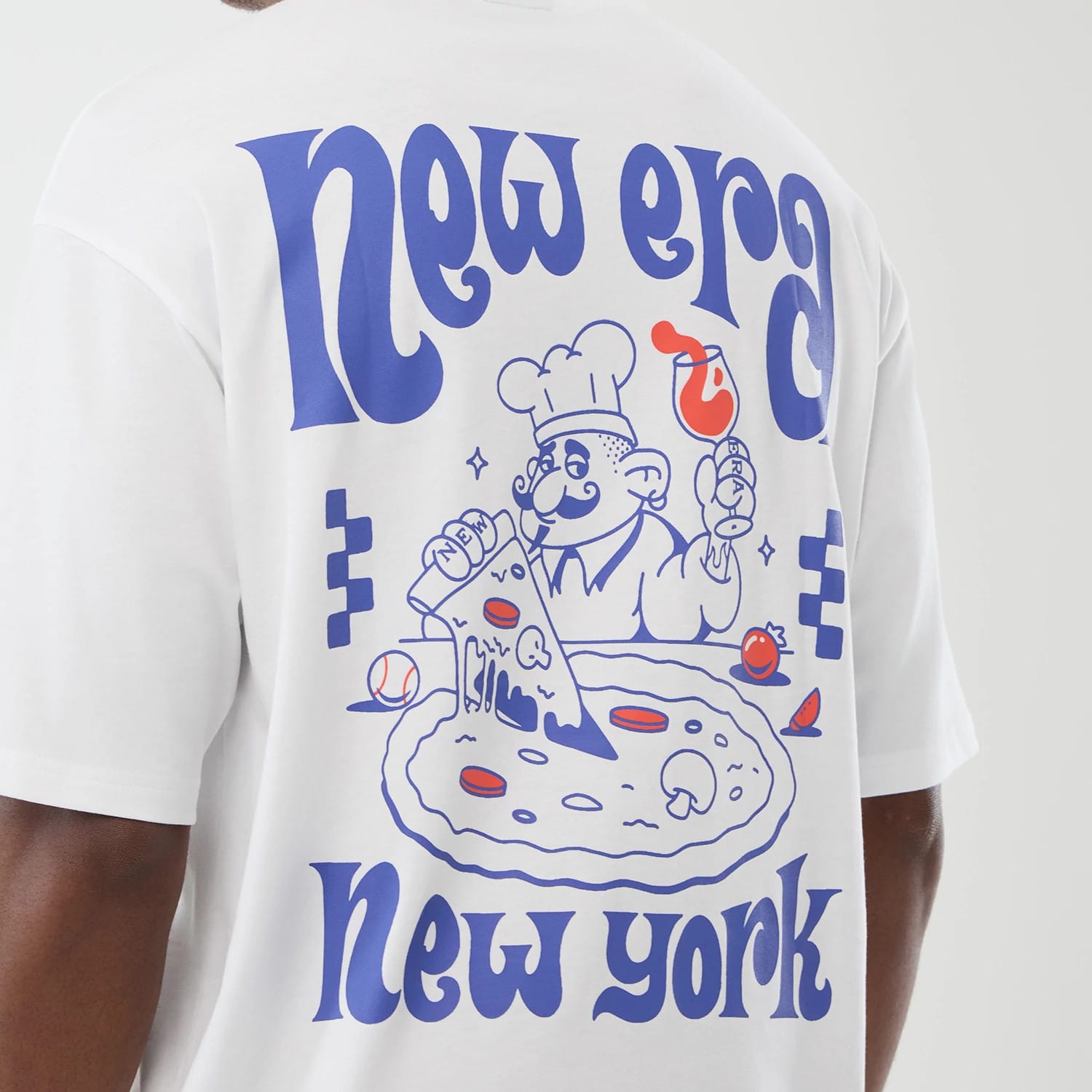 The model is wearing this New Era Fun Pizza Graphic Oversized T-Shirt in white. 4