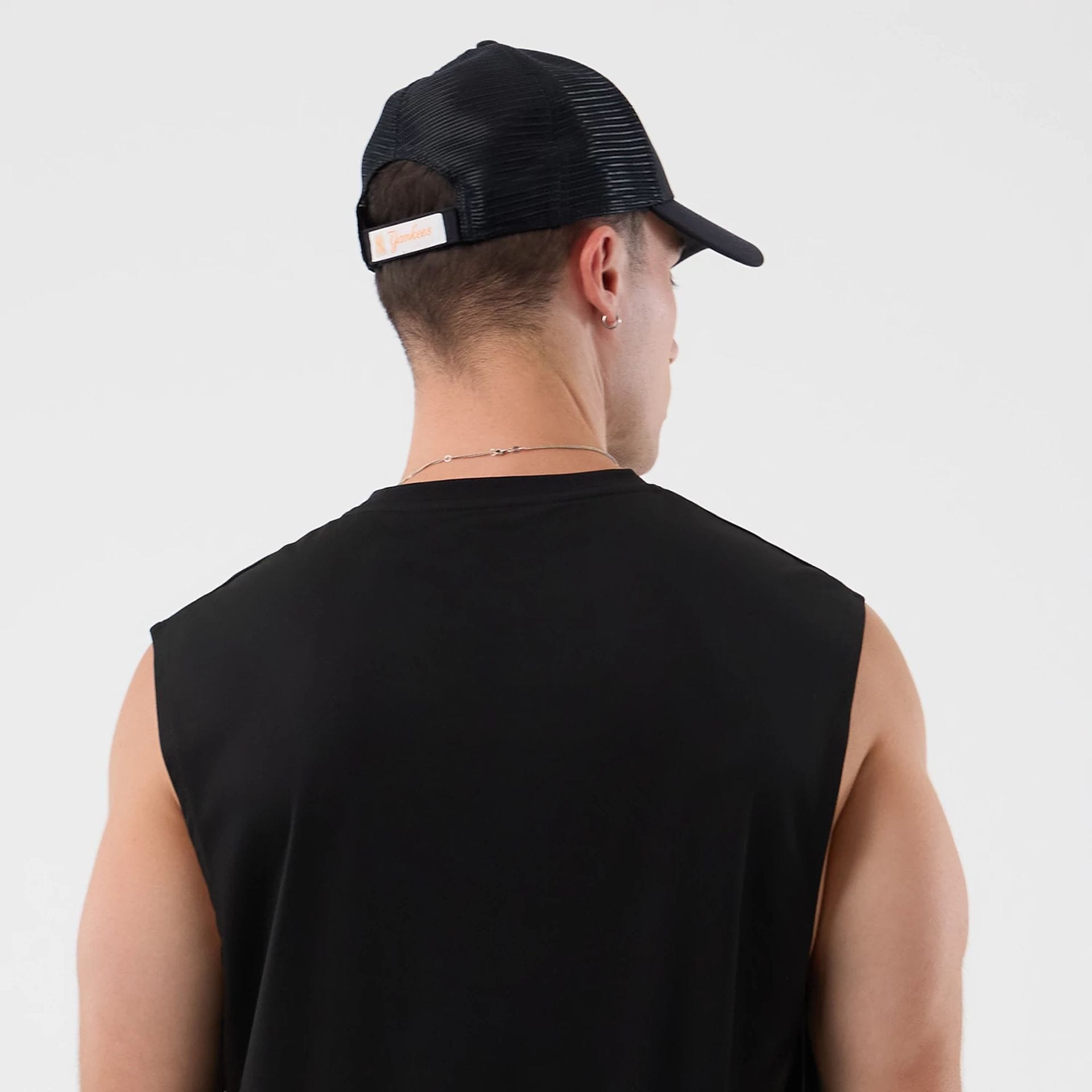 The model is wearing this MLB Core Plus New York Yankees Vest in black. 7