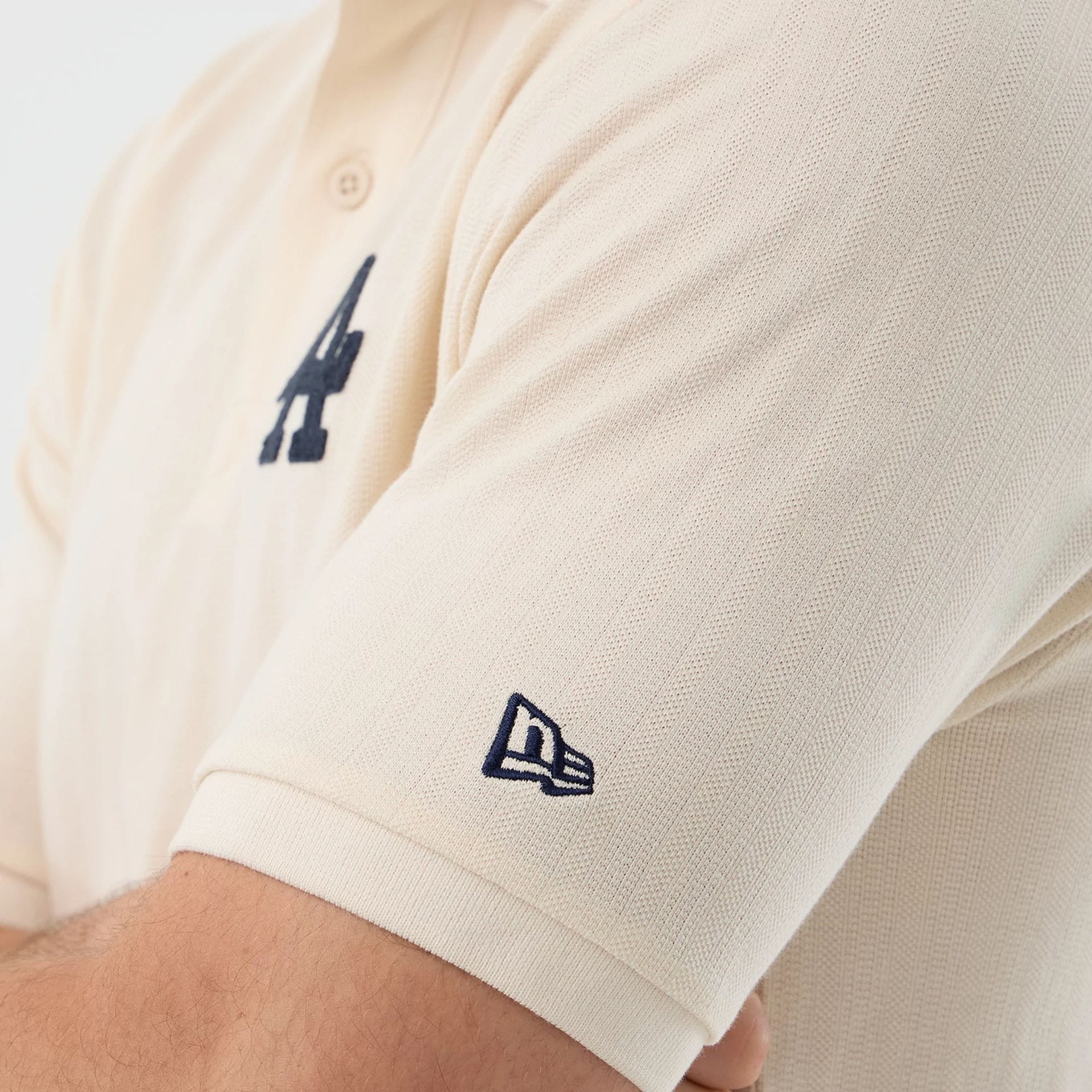 The model is wearing this MLB Rib LA Dodgers Polo T-Shirt in open white. 5