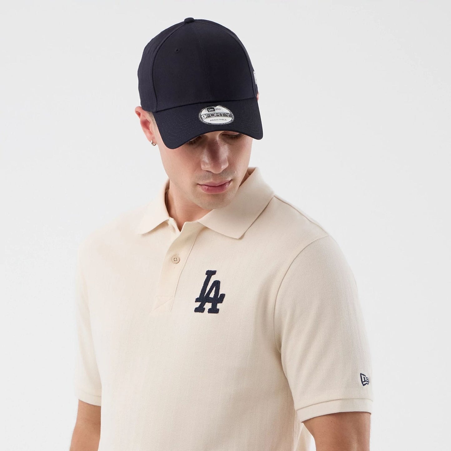 The model is wearing this MLB Rib LA Dodgers Polo T-Shirt in open white. 6