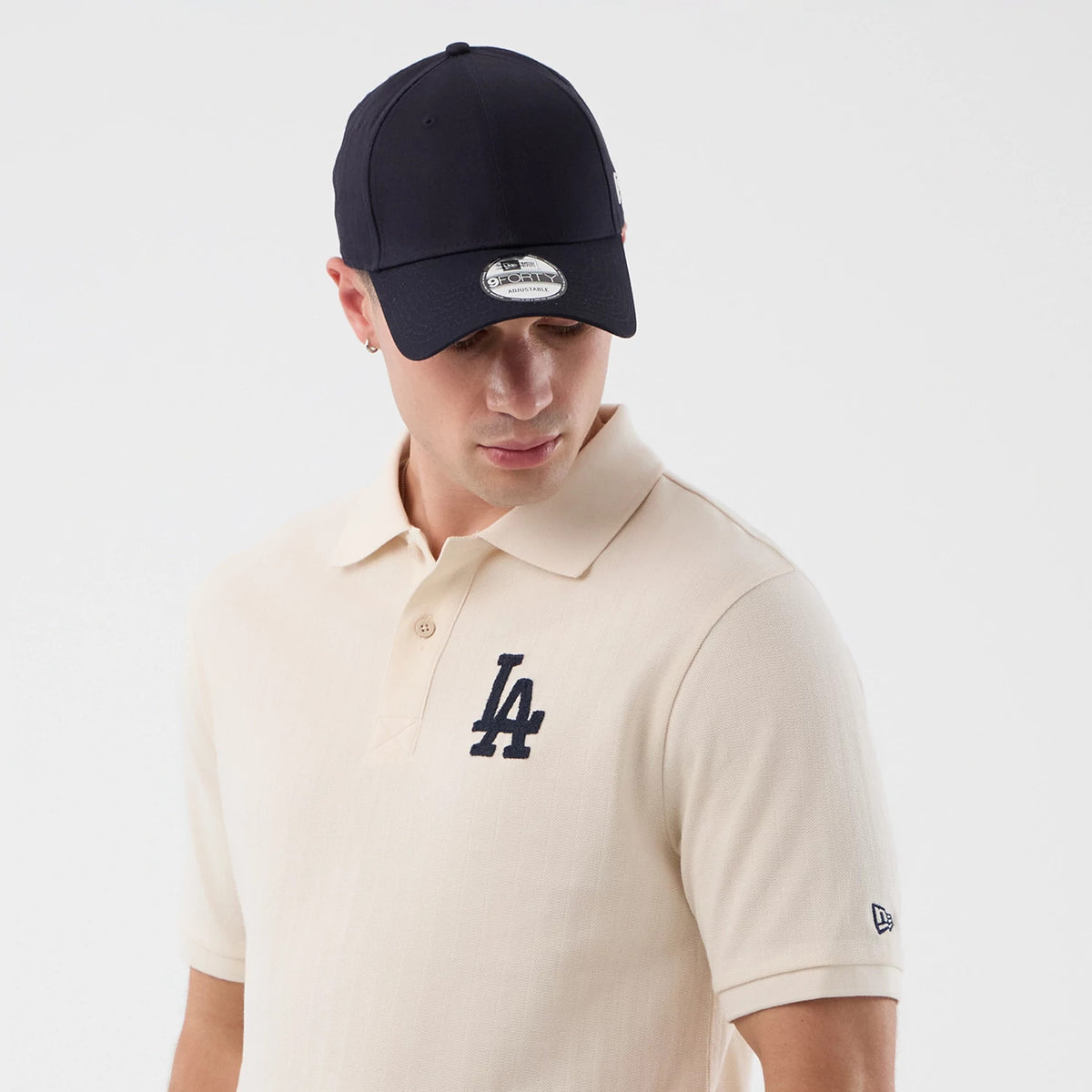 The model is wearing this MLB Rib LA Dodgers Polo T-Shirt in open white. 6