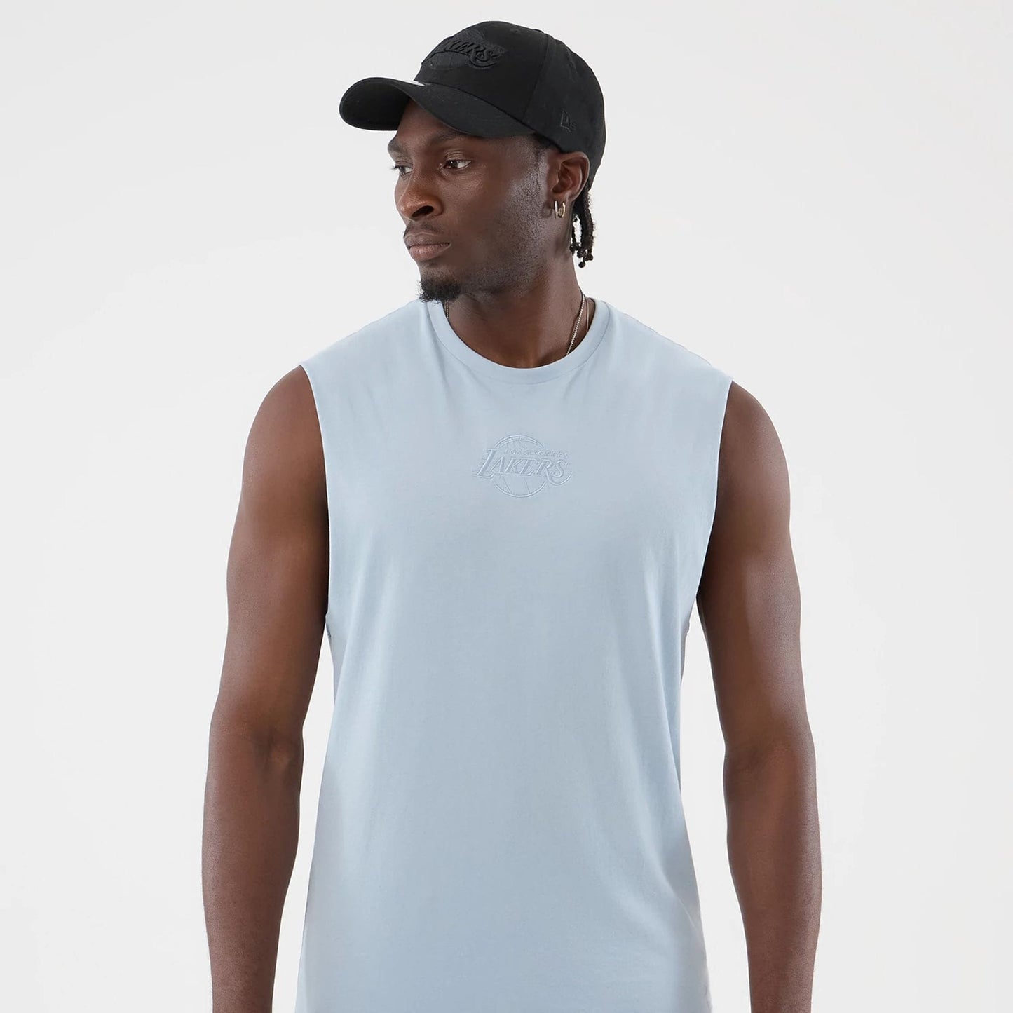 The model is wearing this NBA League Essential LA Lakers Vest in pastel blue. 3