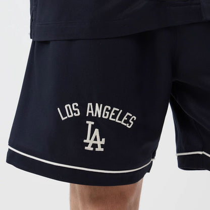 The model is wearing this MLB Woven LA Dodgers Shorts in navy. 4