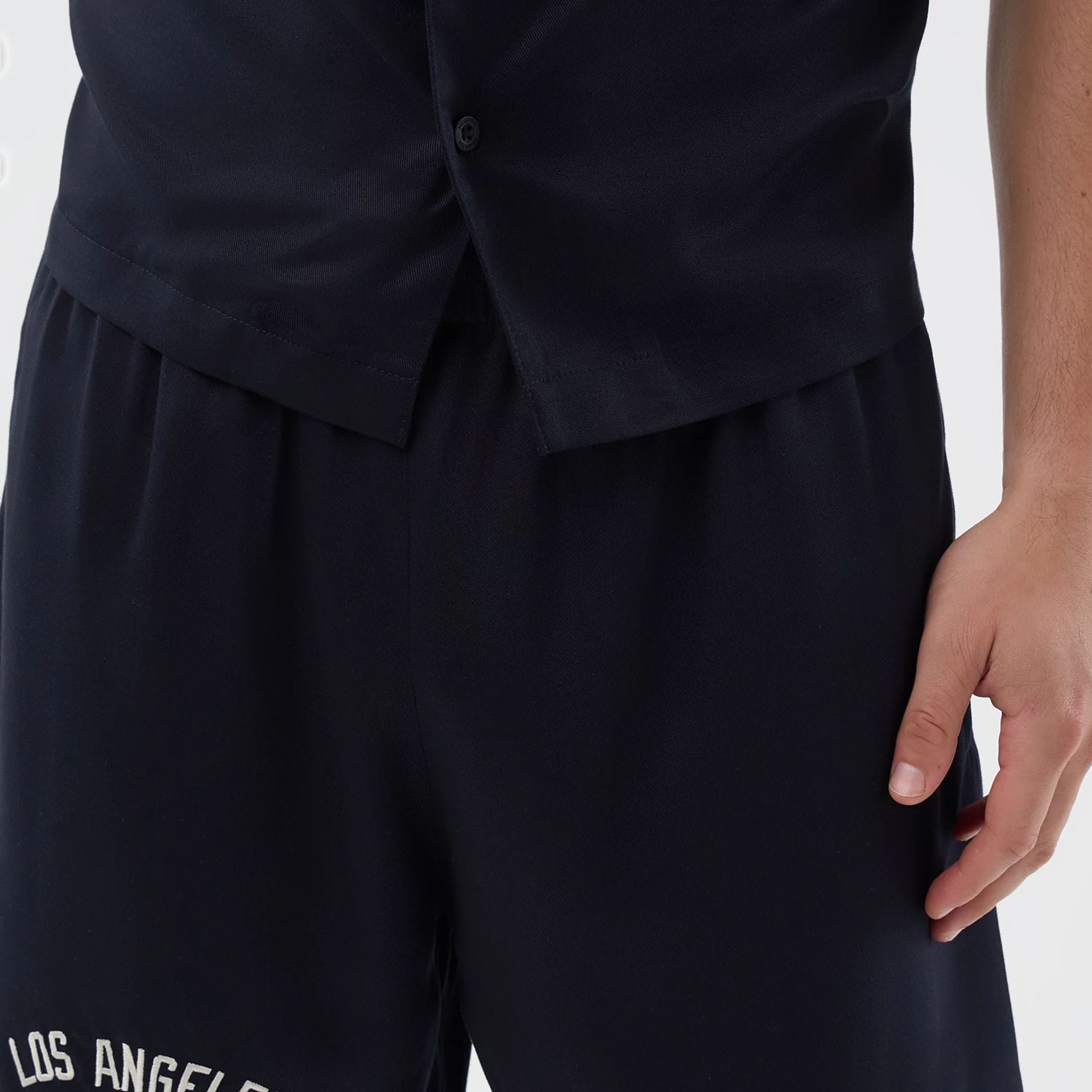 The model is wearing this MLB Woven LA Dodgers Shorts in navy. 6