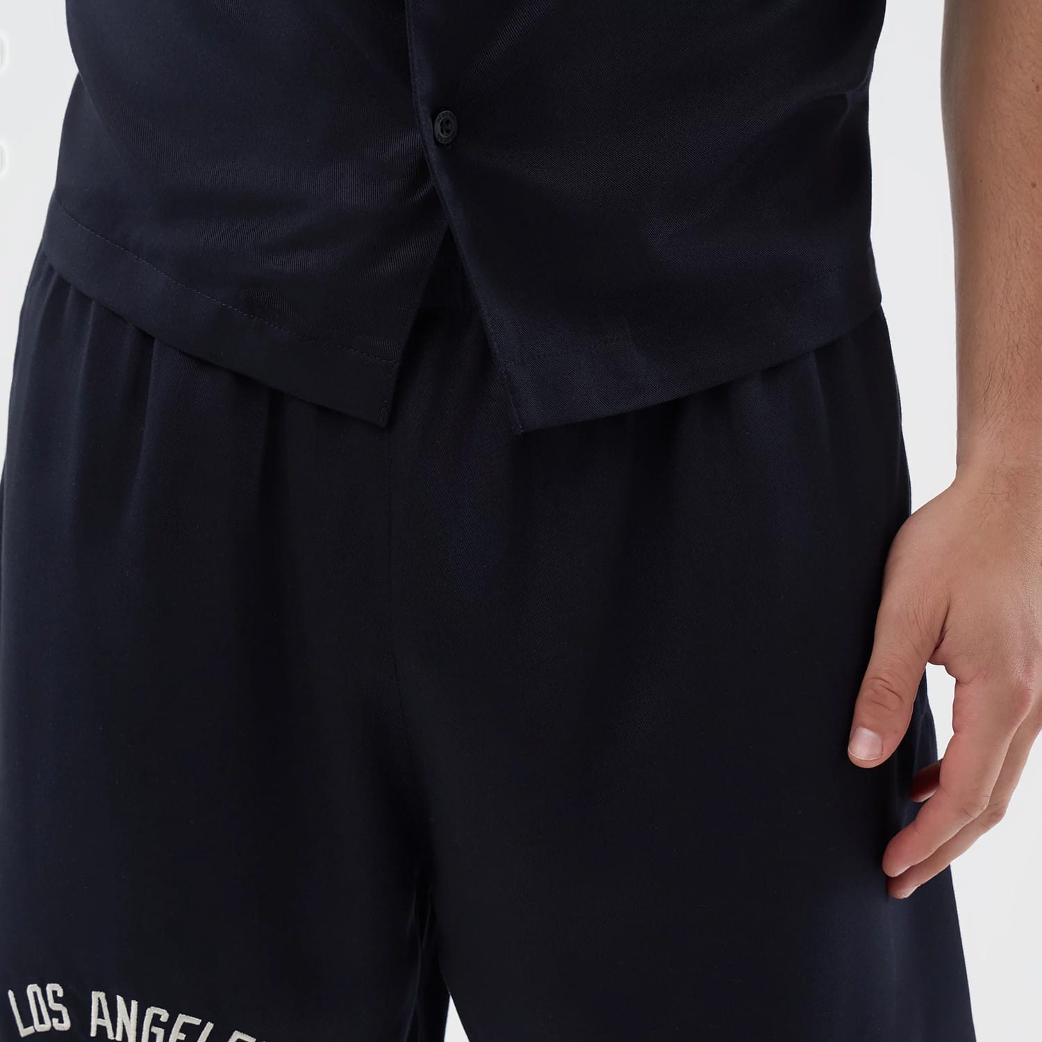 The model is wearing this MLB Woven LA Dodgers Shorts in navy. 6