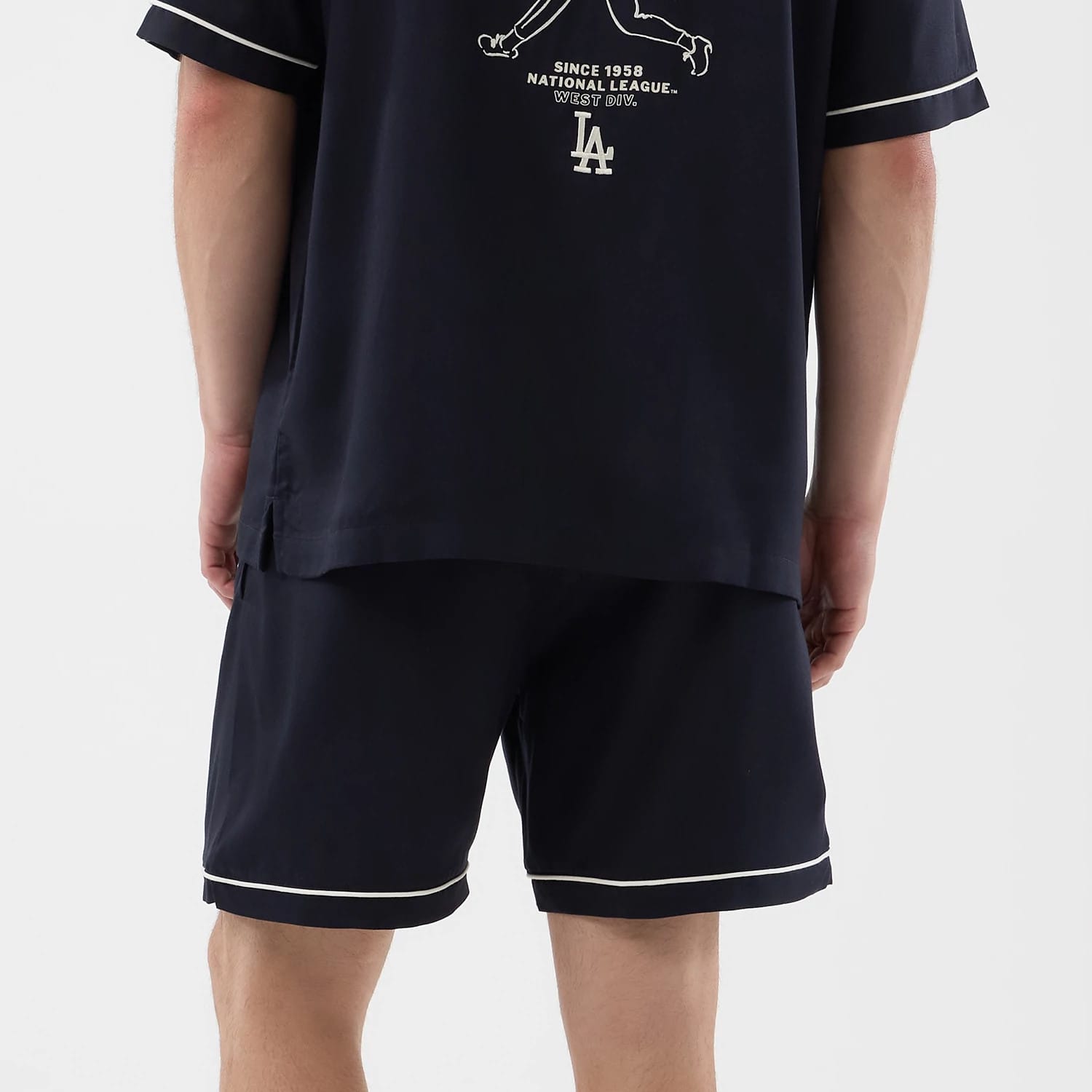 The model is wearing this MLB Woven LA Dodgers Shorts in navy. 7