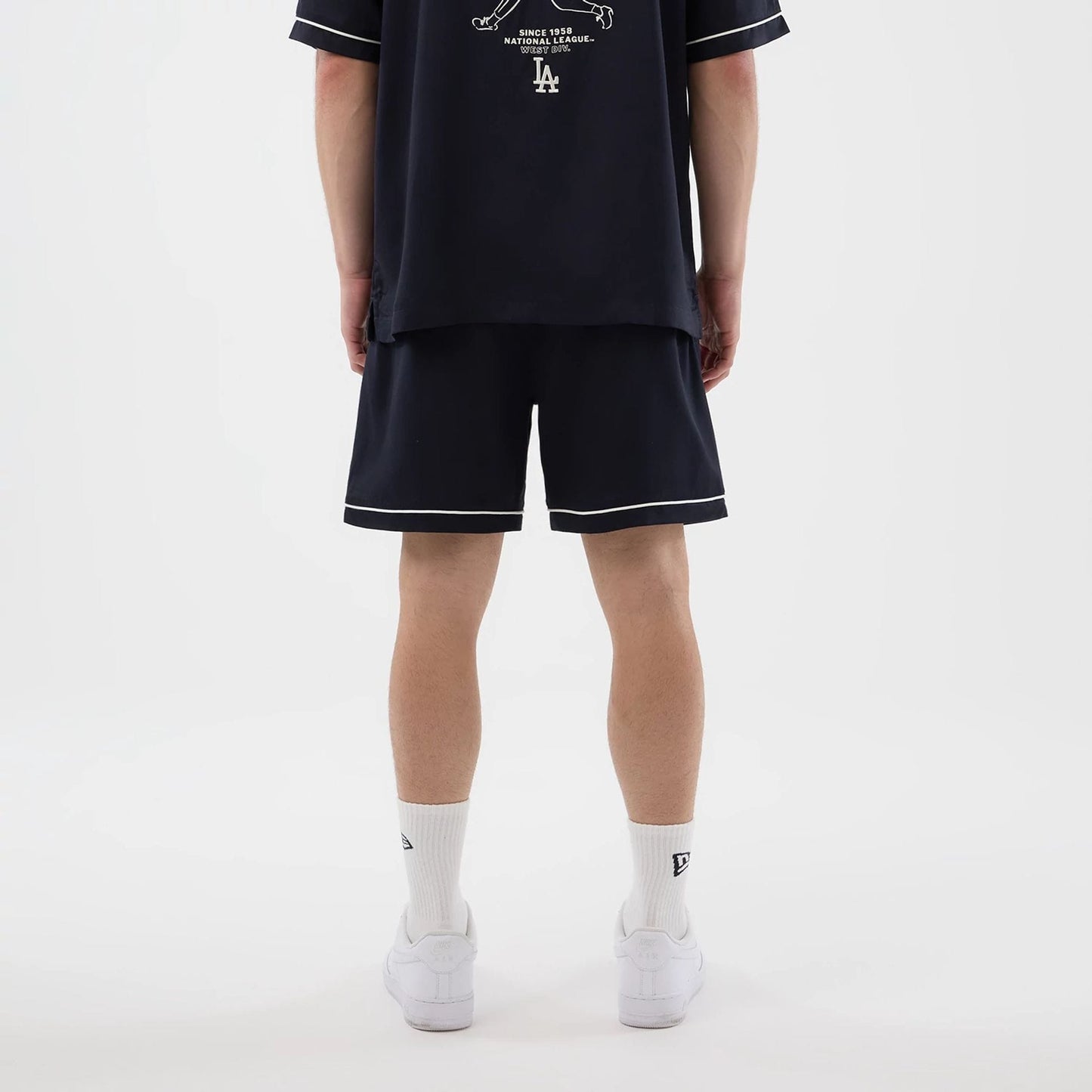 The model is wearing this MLB Woven LA Dodgers Shorts in navy. 2