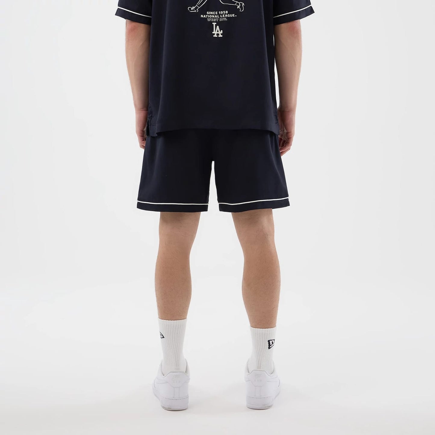 The model is wearing this MLB Woven LA Dodgers Shorts in navy. 2