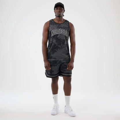 The model is wearing this New Era All Over Print Mesh Shorts in black camo. 7