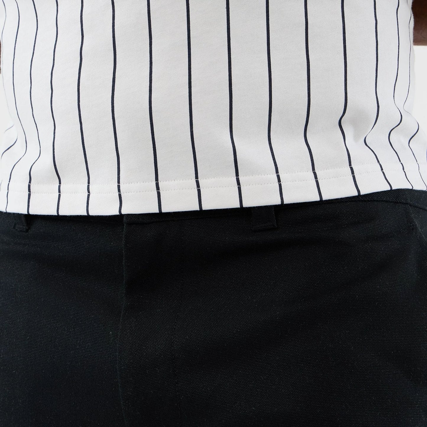 The model is wearing this New Era Cargo Shorts in black. 4