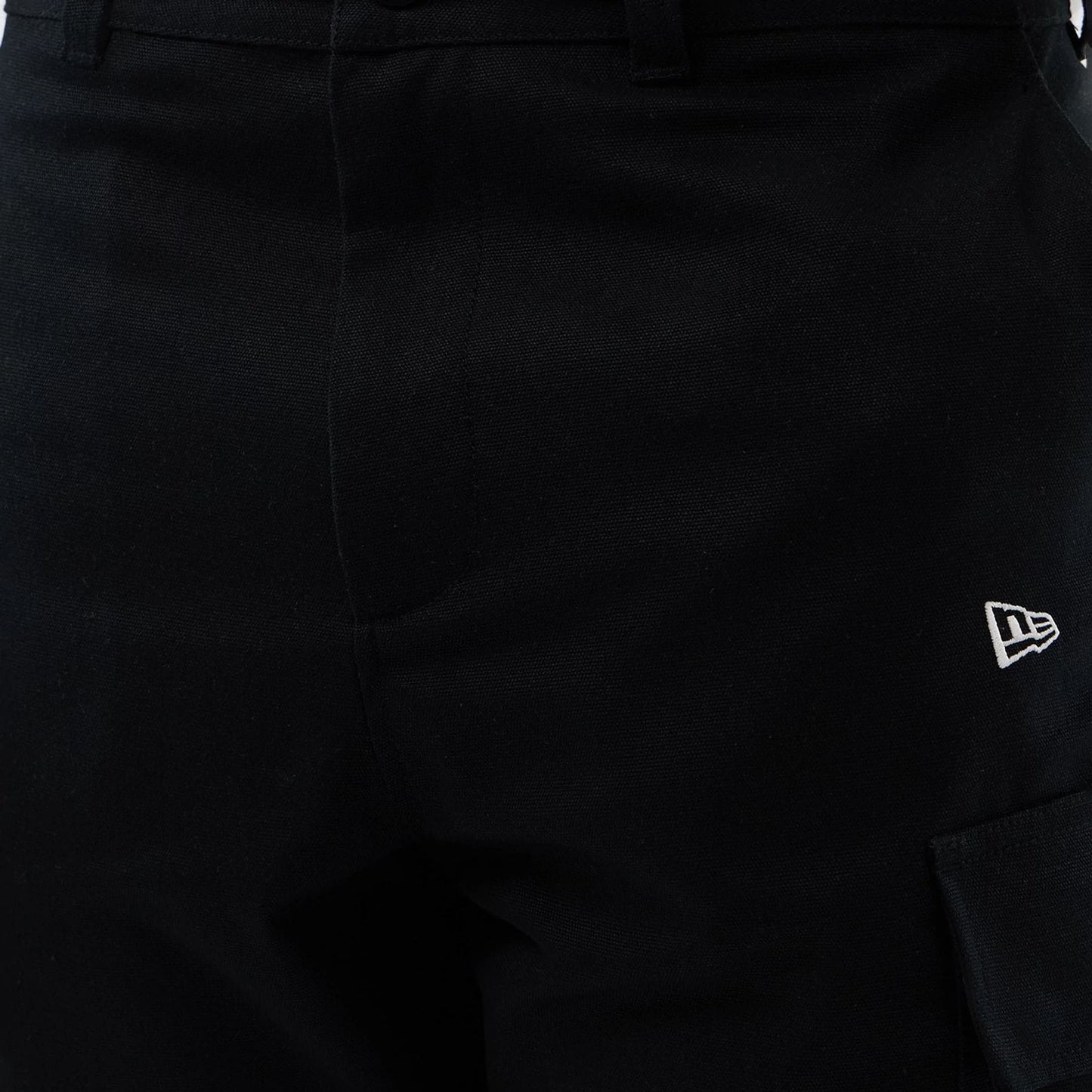 The model is wearing this New Era Cargo Shorts in black. 6