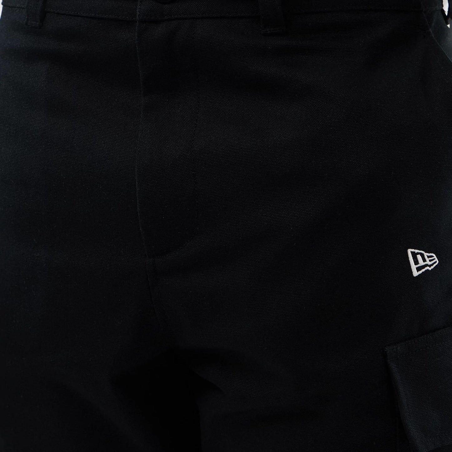 The model is wearing this New Era Cargo Shorts in black. 6