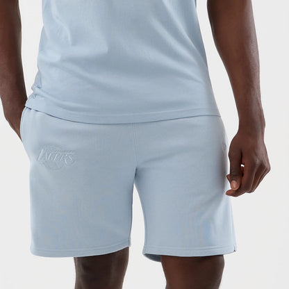 The model is wearing this NBA League Essential LA Lakers Shorts in pastel blue. 6