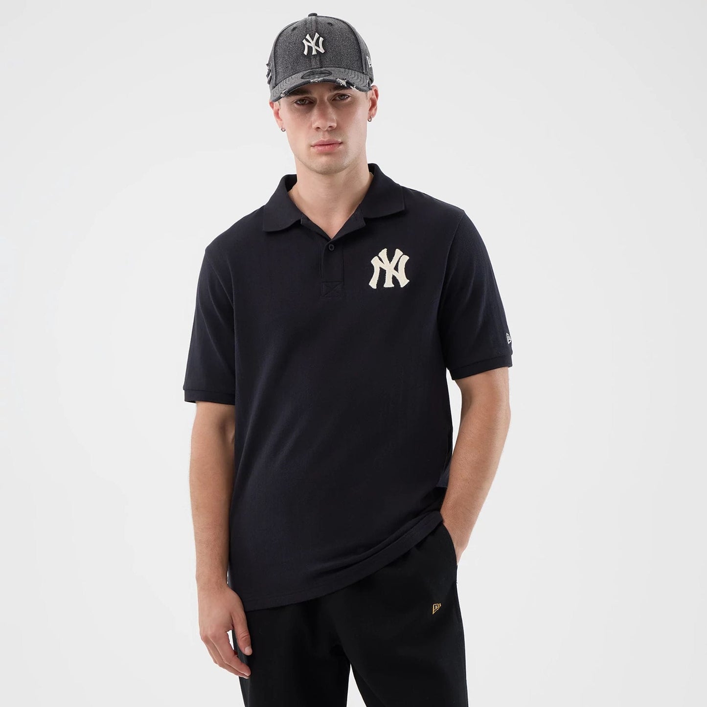 The model is wearing this MLB Rib New York Yankees Polo T-Shirt in navy. 1