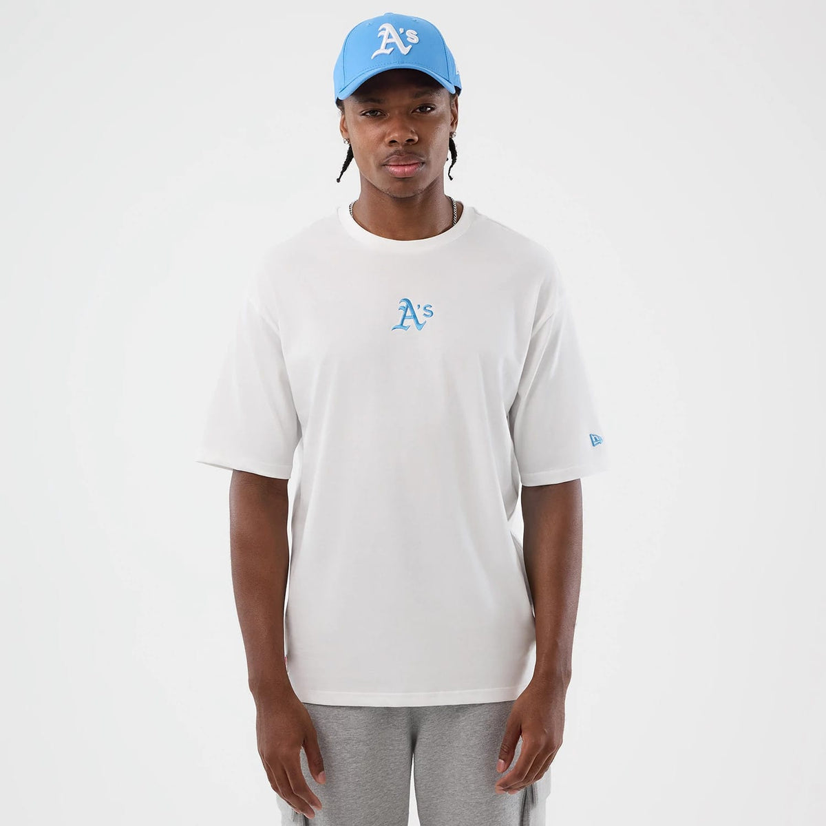 The model is wearing this MLB League Essential Athletics Oversized T-Shirt in white. 3