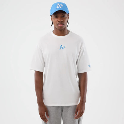 The model is wearing this MLB League Essential Athletics Oversized T-Shirt in white. 3
