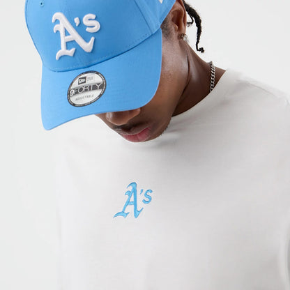 The model is wearing this MLB League Essential Athletics Oversized T-Shirt in white. 5