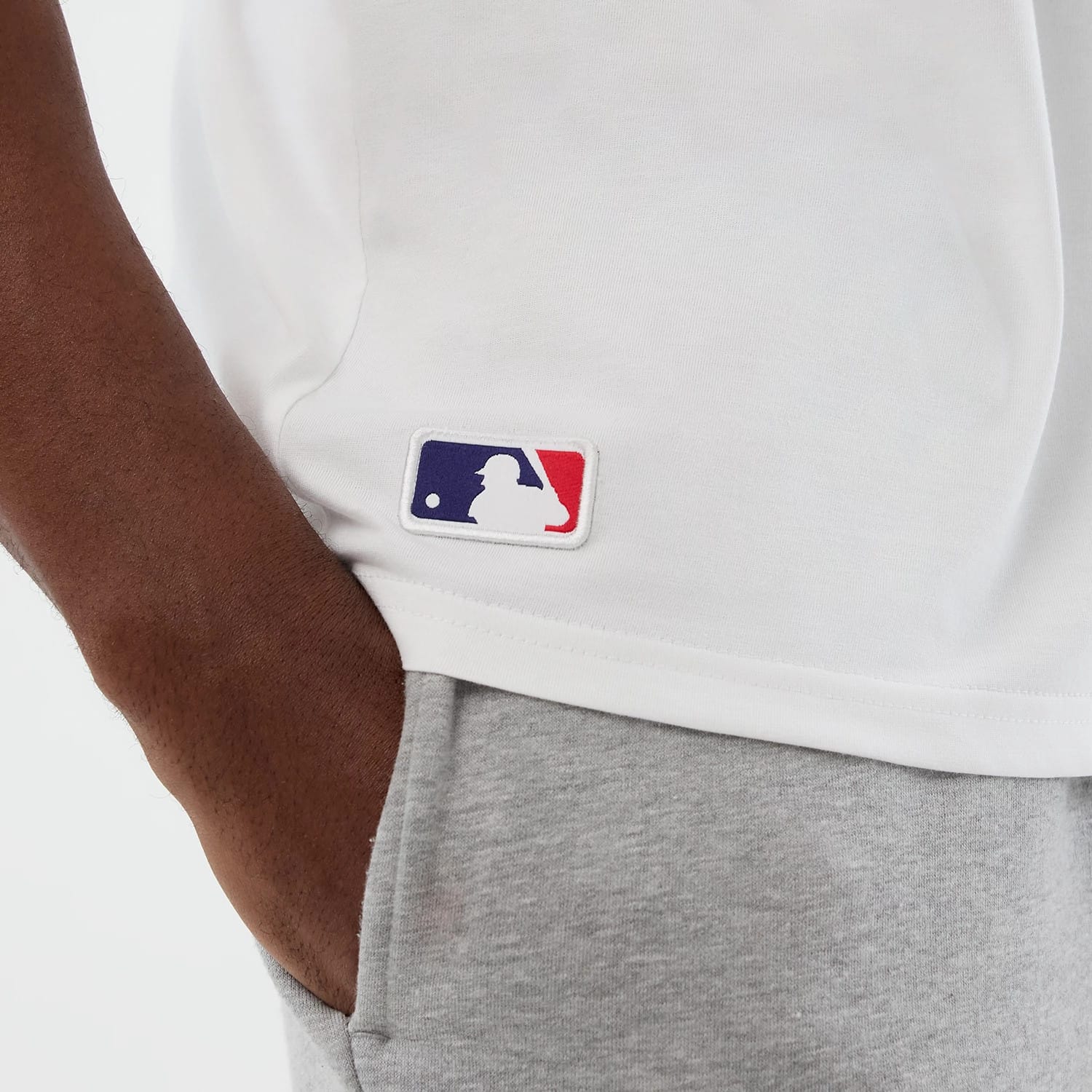 The model is wearing this MLB League Essential Athletics Oversized T-Shirt in white. 8