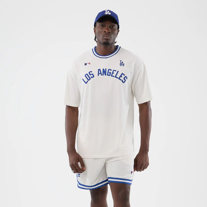 The model is wearing this MLB Arch LA Dodgers Oversized T-Shirt in open white. 1